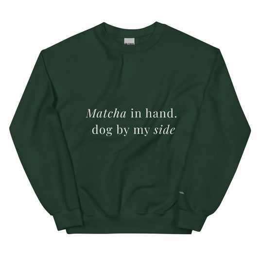 Green sweatshirt with text 'Matcha in hand, dog by my side' on a white background