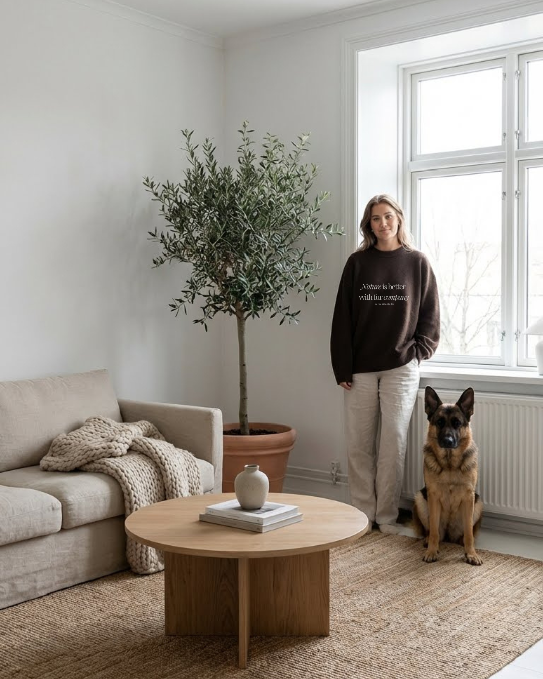 Dog mom wearing Nature is better with fur company crewneck