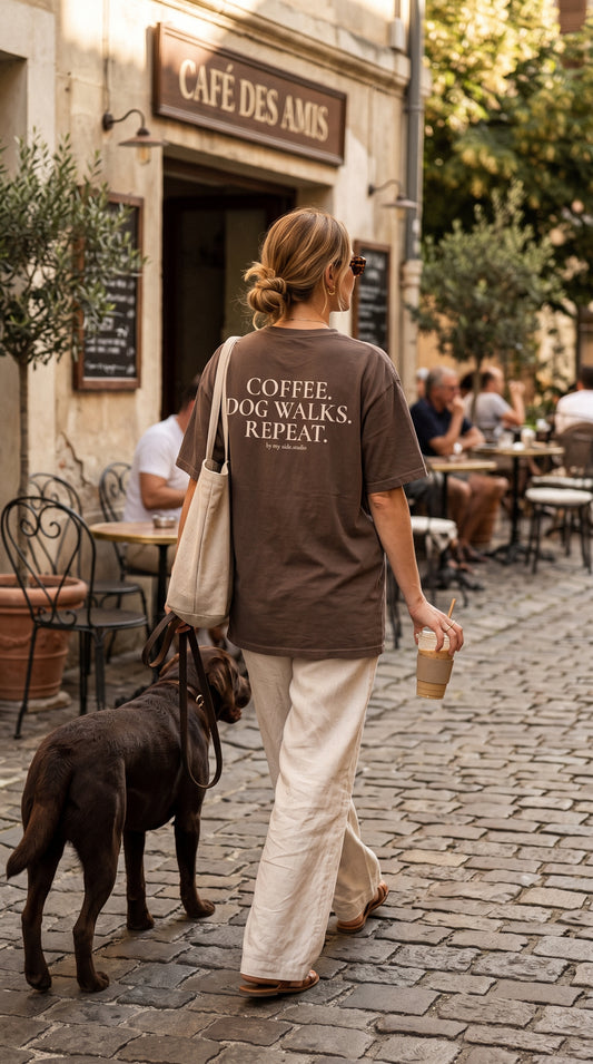 Coffee, dog walks and repeat women walking in coffee shop with her chocolate labrador dog
