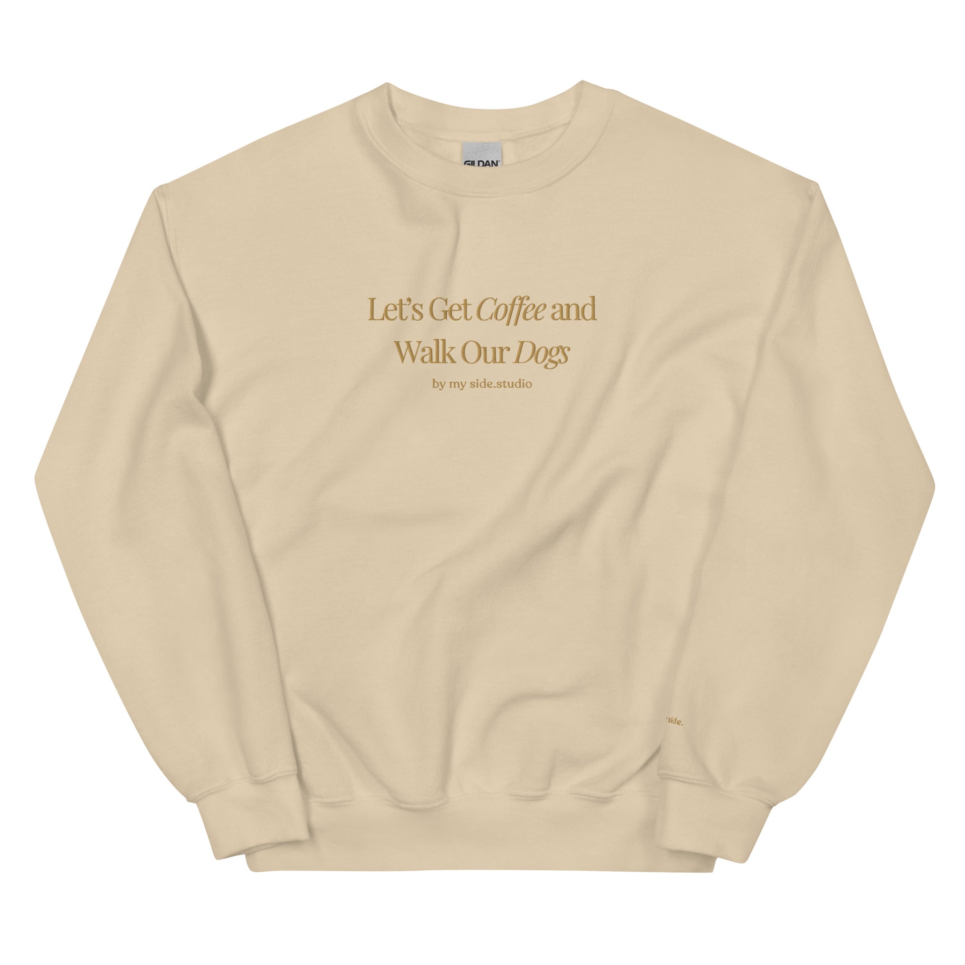 Beige sweatshirt with text 'Let's Get Coffee and Walk Our Dogs' on a white background